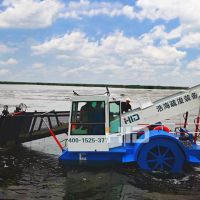 Automated waterweed harvester collecting floating plants
